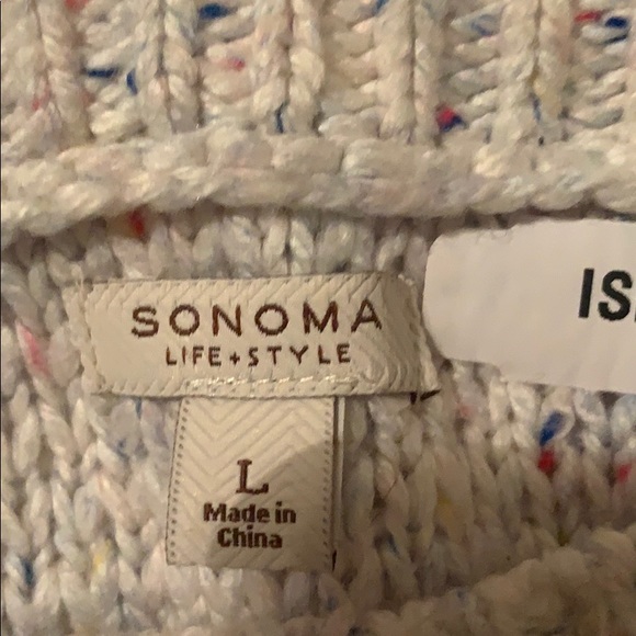 A cream white sweater. - Picture 3 of 3